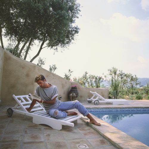 Brian Aris - George Michael Reading on Sunlounger, San Tropez 1988