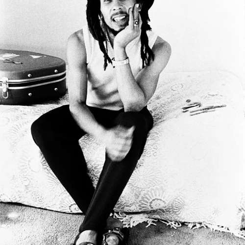Dennis Morris - Bob Marley Sitting on Bed, Hotel, London 1977
